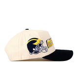 Show your Michigan pride with the No Rivals Michigan Wolverines Alma Mater Hat—a beige snapback cap featuring a black brim, large yellow and navy embroidered text, and a detailed football helmet design in navy and yellow on the side. The perfect finishing touch for your gameday fit!.