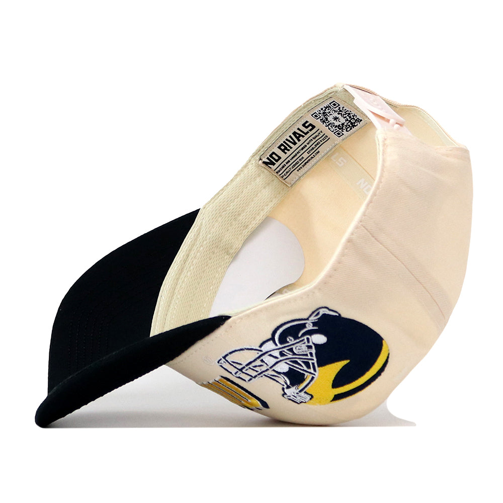 A cream and black Michigan Wolverines Alma Mater Hat by No Rivals is turned inside out, revealing an embroidered logo on the side and a tag with text plus a QR code inside the brim—perfect for elevating your gameday fit.
