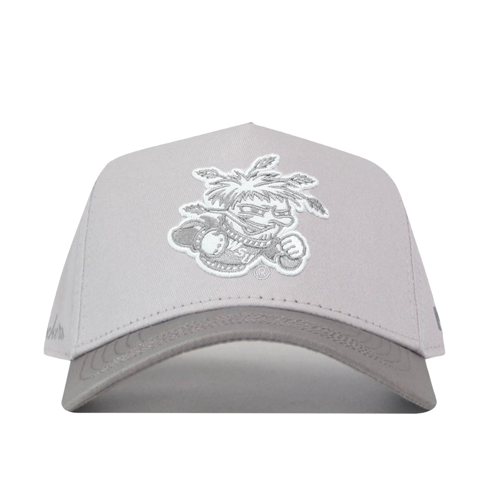 The Wichita State Graphite Hat by No Rivals features a light grey snapback with a white embroidered cartoon mascot in a feathered headdress—an ideal pick for your gameday outfit.