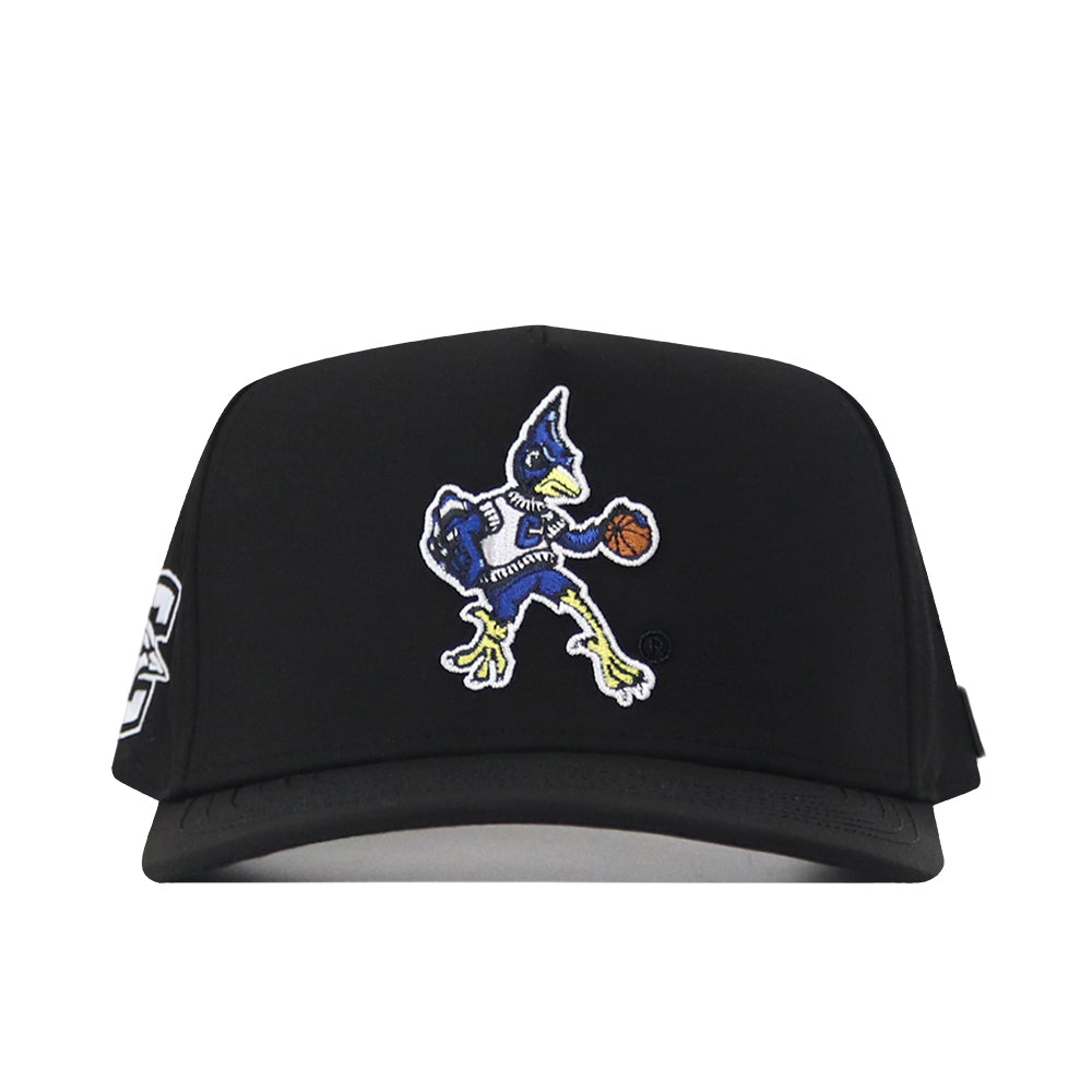 The Creighton Bluejays Basketball Hat by No Rivals is a black cap featuring an embroidered cartoon roadrunner dribbling a basketball on the front and includes a snap back closure for a comfortable, customizable fit.