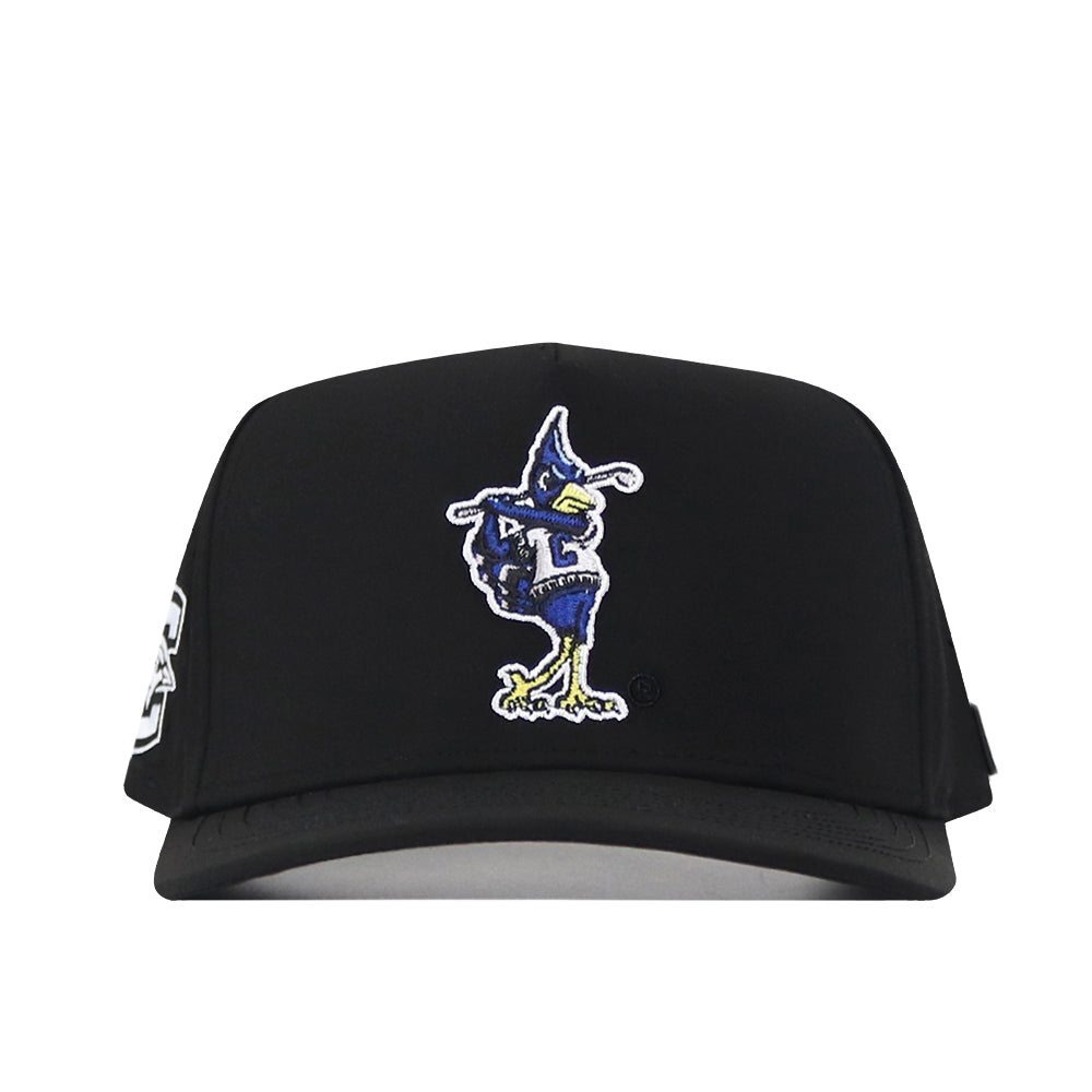 No Rivals Creighton Bluejays Golf Hat in black, featuring a vibrant cartoon Bluejay mascot embroidered on the front with a blue head, yellow beak, and green feet. This snapback cap is perfect for your gameday fit and includes a patch on the left side.