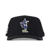 No Rivals Creighton Bluejays Golf Hat in black, featuring a vibrant cartoon Bluejay mascot embroidered on the front with a blue head, yellow beak, and green feet. This snapback cap is perfect for your gameday fit and includes a patch on the left side.
