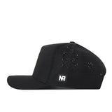 Showcased in a side profile, the Creighton Bluejays Golf Hat by No Rivals features a sleek black design with small ventilation holes and a flat brim. The front sports a subtle rectangular NR patch alongside an embroidered logo for an elevated look. Designed for the perfect gameday fit, this hat offers an adjustable snap back closure for customized comfort.