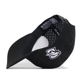 A black Creighton Bluejays Golf Hat by No Rivals is shown upside down, displaying its inner labels and ventilation holes. The cap features a stylish white Bluejays logo embroidered on the side, making it the perfect snapback for your next gameday outfit.