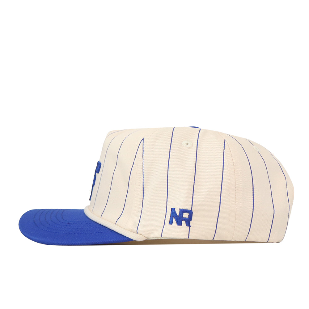 Introducing the Air Force Pinstripe Hat from No Rivals—a cream-colored, officially licensed snapback baseball cap featuring thin blue pinstripes, a bold blue flat brim, and the NR initials expertly embroidered in blue on the side. Designed with an unstructured fit, this hat delivers all-day comfort and timeless style.