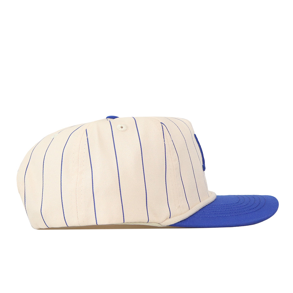 A profile-view image of the Air Force Pinstripe Hat by No Rivals, an officially licensed, cream-colored snapback with thin blue vertical stripes and a solid blue flat brim. This unstructured baseball cap offers relaxed comfort and modern style.