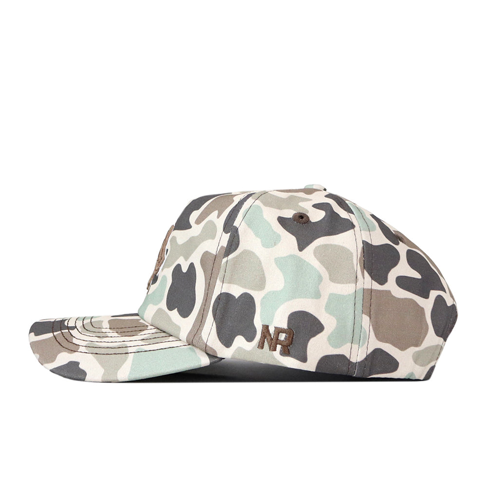 A No Rivals Boise State Huntsman Hat featuring a camouflage pattern in shades of green, brown, and beige. This cap includes visible stitching, an adjustable snapback closure, and an embroidered NR logo on the left side near the brim.