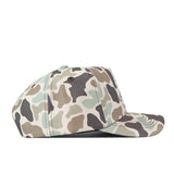The Wichita State Huntsman Hat by No Rivals is a high-quality cotton baseball cap in green, brown, and beige camo with a flat brim and top button, shown from the side on a white background.