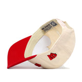 The No Rivals Wisconsin Badgers Upside Down Wisconsin Hat - Classic is shown inside out, revealing the interior label, QR code, and stitching details. This officially licensed snapback cap showcases bold red embroidered letters on the outside.
