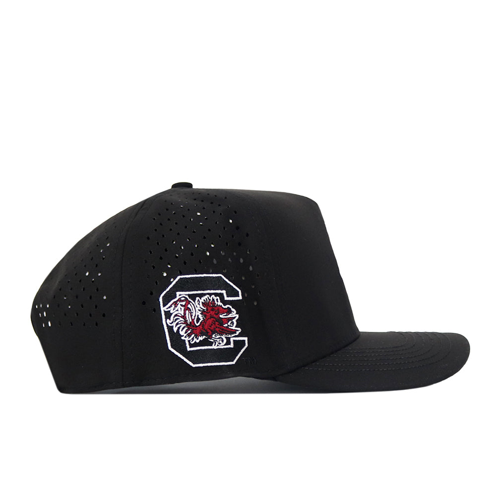 The No Rivals South Carolina Gamecocks Football Mascot Hat - Black features a flat, uncurved brim and a comfortable snap back closure. Crafted from performance fabric with perforated side panels, this hat is highlighted by a large white C outlined in black on the front and an embroidered Gamecock logo on the side.