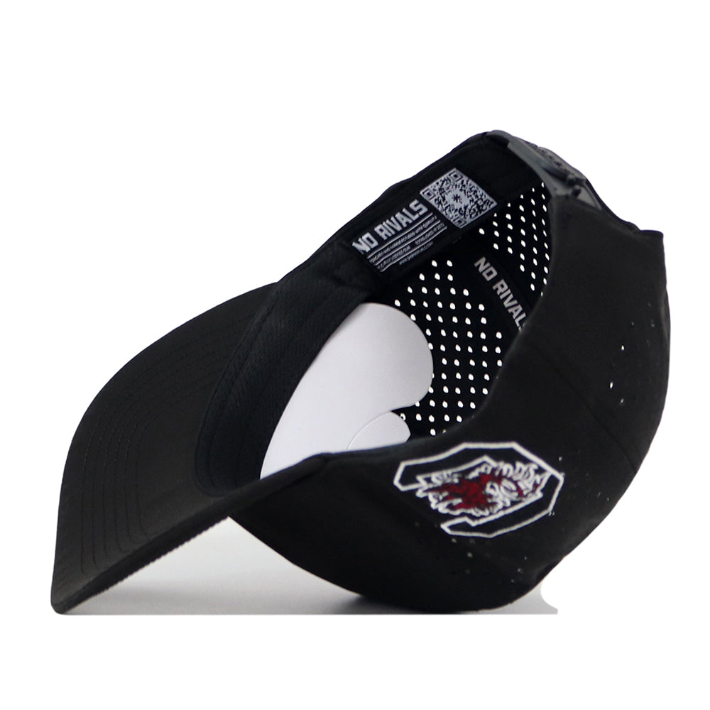 The South Carolina Gamecocks Football Mascot Hat by No Rivals is shown in black, flipped upside down to reveal its inner lining with white polka dots and the NO RIVALS branding. The front displays an embroidered Gamecocks mascot logo in white, red, and black. Featuring a snap back closure for an adjustable fit, this cap blends spirited style with everyday comfort.