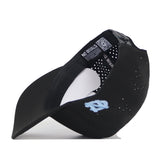 The North Carolina Tar Heels Mascot Hat by No Rivals is a black performance fabric cap featuring light blue embroidery on the side. Shown from an angle that reveals the inside, it includes a QR code and “NO RIVALS” text on the inner band. The snapback adjustment ensures a comfortable, customizable fit.