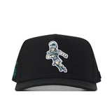 Introducing the Michigan State Spartans Football Mascot Hat in Black by No Rivals—a performance fabric snap back crafted for comfort and durability. This officially licensed cap showcases an embroidered Spartan warrior mascot in silver and teal on the front, delivering both style and function for every fan.