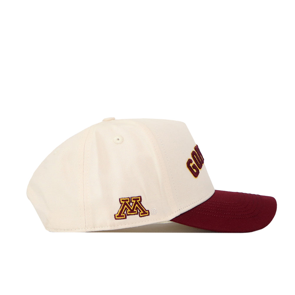 The Right Side Up Gophers Hat - Minnesota - Classic by No Rivals is a cream baseball cap with a maroon brim, featuring an officially licensed University of Minnesota "M" embroidered on the side and partial "GOLD" text above the brim.