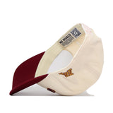 The Right Side Up Gophers Hat - Minnesota - Classic by No Rivals is a cream and maroon baseball cap shown from the side, with a curved brim facing left. It features an embroidered "M" logo and an interior tag reading NO RIVALS. This officially licensed snapback blends classic style with premium detailing.