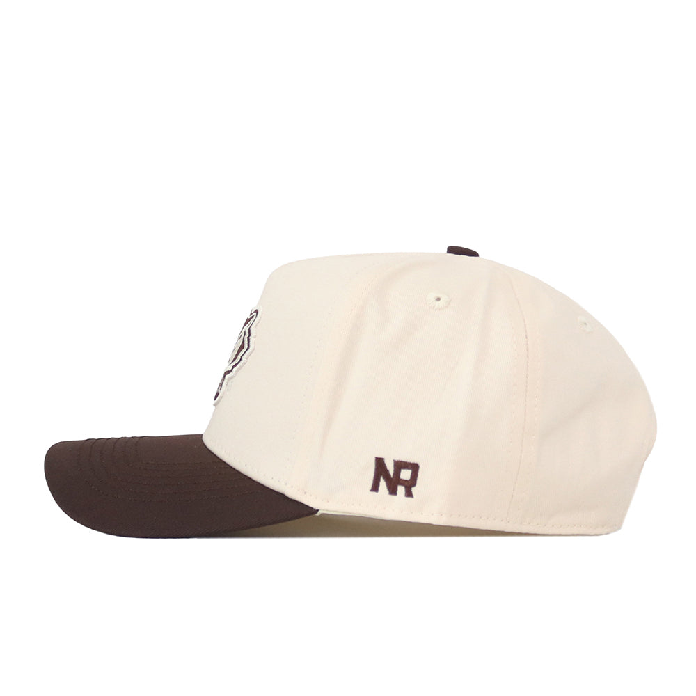 A side view of the No Rivals Wisconsin Badgers Espresso Hat showcases its beige crown paired with a dark brown brim. The left side near the brim features "NR" embroidered in brown, and its snap back closure offers a comfortable, adjustable fit for gameday.