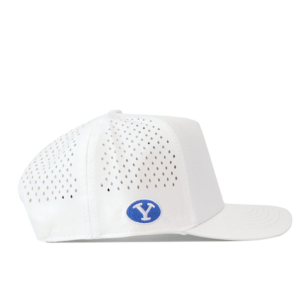 BYU Cougars Football Mascot Hat - White by No Rivals: Perforated white baseball cap made from performance fabric, featuring a blue oval embroidered logo patch on the side. Designed with a flat brim, ventilation holes throughout the crown for breathability, and an adjustable snap back closure for a comfortable fit.