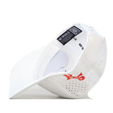 Sam Houston State Football Sammy Hat - White by No Rivals displayed upside down to reveal the inner label featuring NO RIVALS text, a QR code, and a red logo on the side. Made from performance fabric, this hat includes ventilation holes, a curved brim, and a classic Snap Back closure for adjustable comfort.