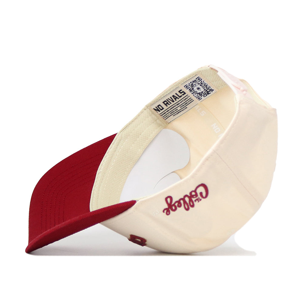 A No Rivals Right Side Up Charleston Hat - Classic in red and cream is pictured upside down, revealing the inside label, cream interior, and “Go Dogs” embroidery on the side. This officially licensed cap features an embroidered logo for a stylish finish.