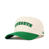 This is the Upside Down Marshall Hat by No Rivals, an officially licensed Marshall Thundering Herd snapback. The cap features a white crown with a green brim and showcases the word "MARSHALL" embroidered in green and black letters in an arched design on the front. A small green logo accents the left side of the hat, making it a standout accessory for any fan.