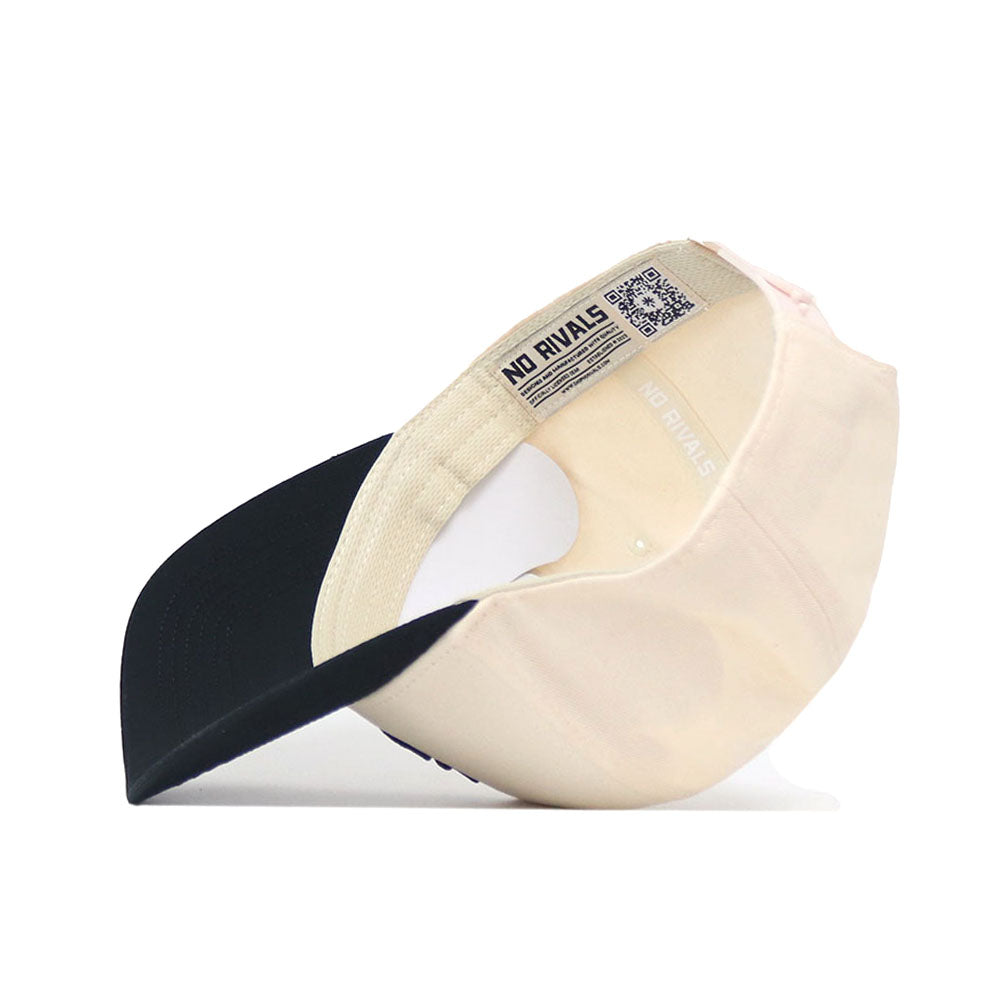 A beige and black App State Logo Patch Hat - Yosef by No Rivals is shown upside down, revealing its interior NO RIVALS label, QR code near the back opening, and detailed embroidered logos for an officially licensed look.