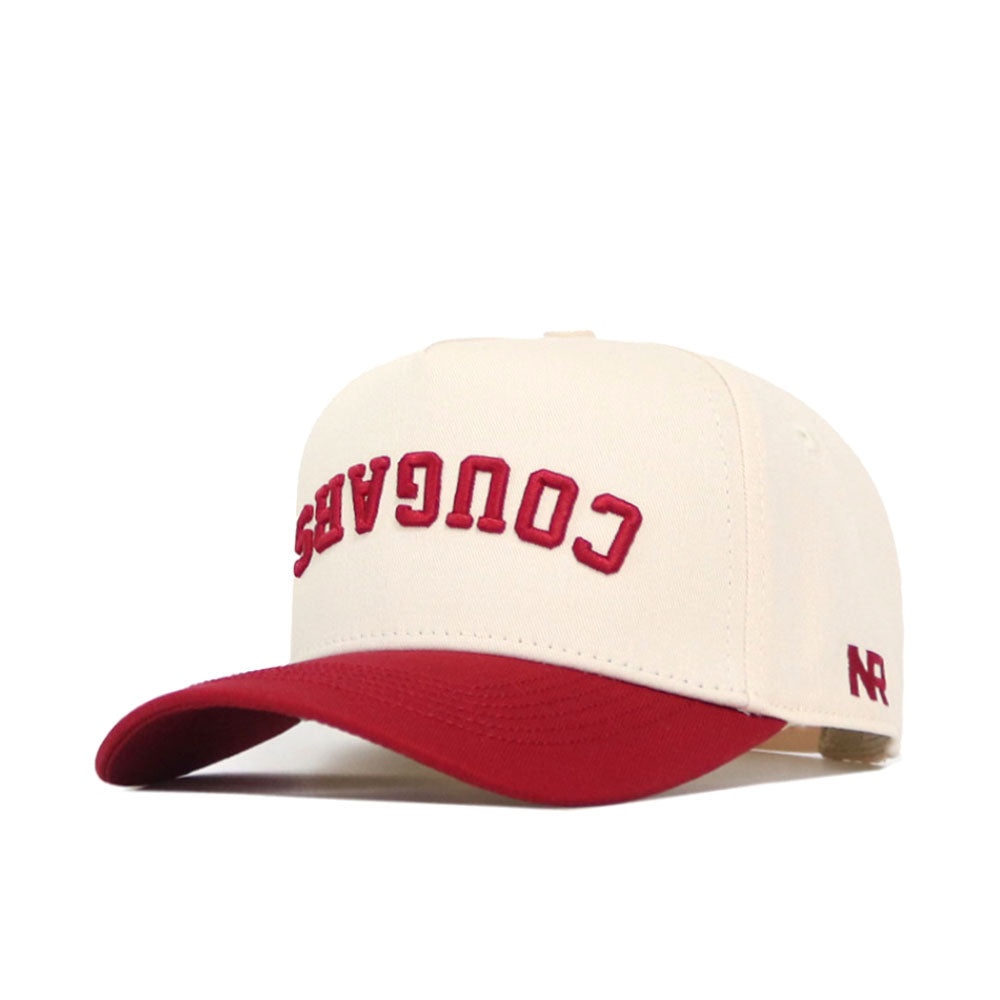 The No Rivals Upside Down Cougars Hat - Washington State features a cream color, red brim, snapback closure, COUGARS embroidered upside down in red on the front, and an NR logo on the side.