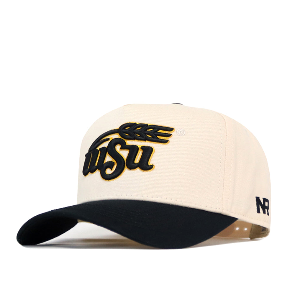 The Wichita State Patch Hat by No Rivals is a cream cotton snapback with a black brim, featuring WSU and wheat embroidery in black and gold, plus NR stitched on the side. Officially licensed.