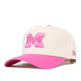 The No Rivals Michigan Pink Out Hat is a white snapback baseball cap featuring a vibrant pink visor and a bold pink letter “M” on the front. A smaller pink logo accents the left side, making this stylish breast cancer support hat perfect for showing your spirit and solidarity.