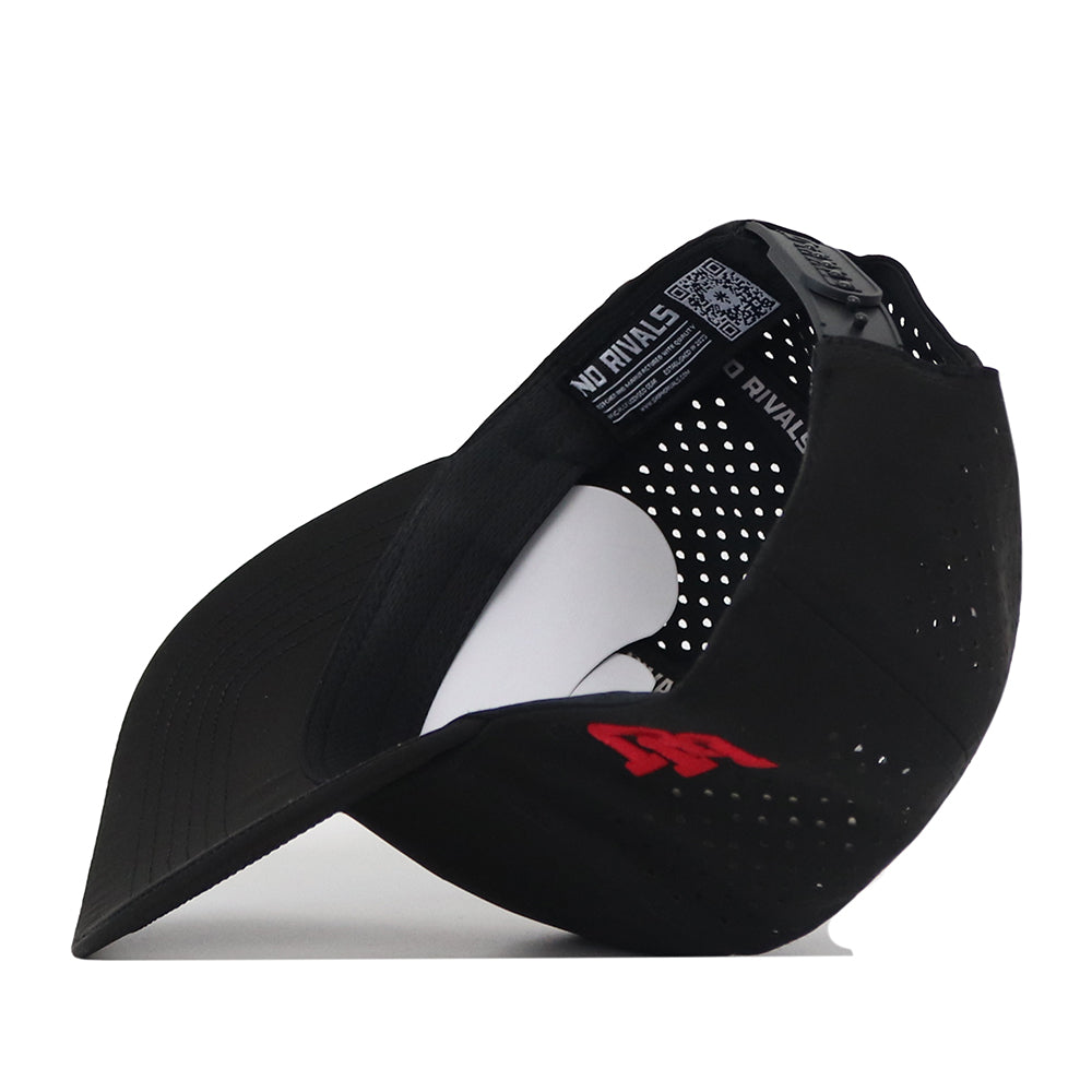The Utah Utes Football Mascot Hat - Black by No Rivals features a curved brim, a red embroidered logo on the side, and perforated back panels made from performance fabric. Inside, branding labels and a white snapback size adjuster provide both style and comfort.