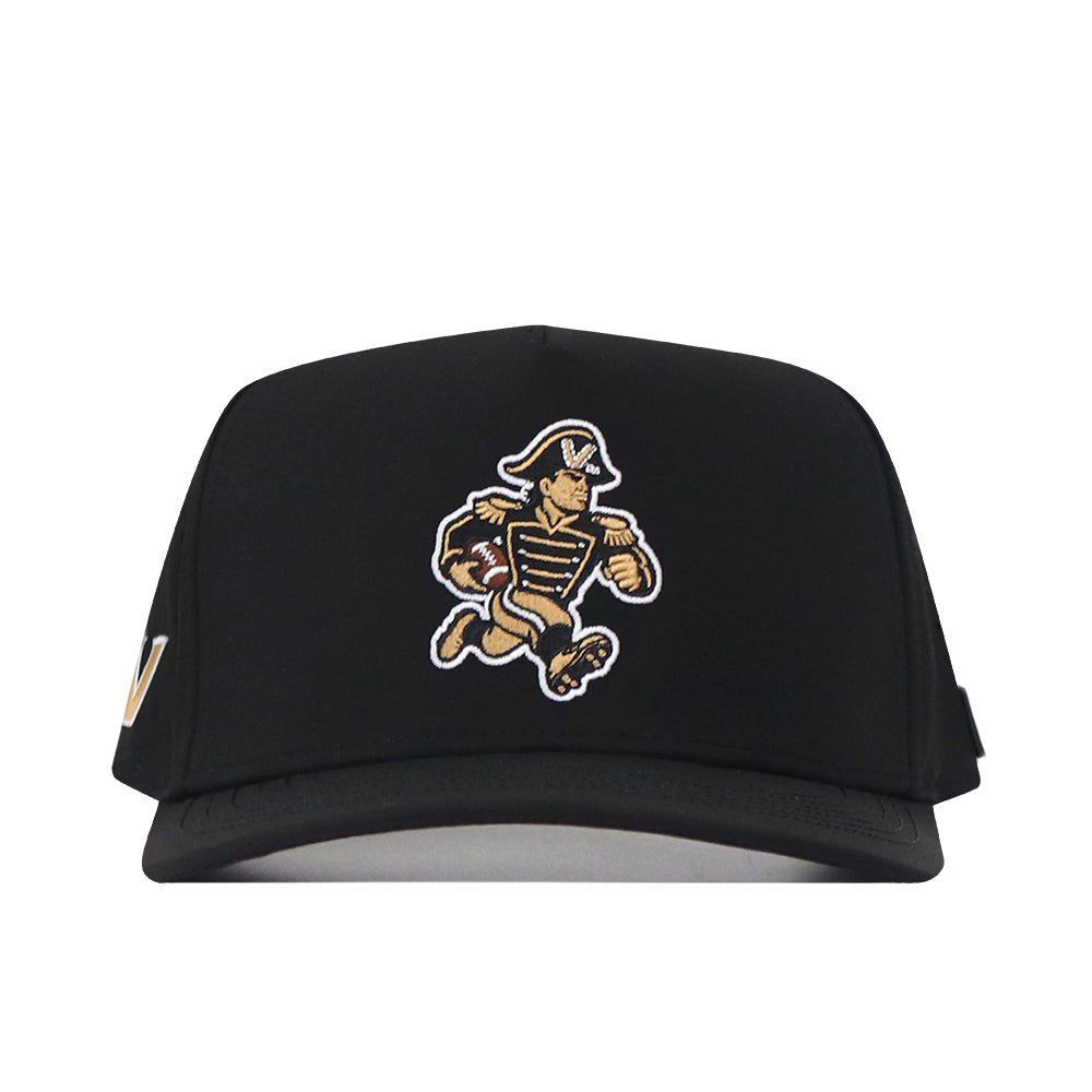 The No Rivals Vanderbilt Commodores Football Mascot Hat in black features an embroidered running cartoon mascot dressed as a colonial soldier, with gold and beige details on the uniform. Made from performance fabric, this snapback cap is displayed from the front.