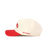 The Right Side Up Nebraska Hat - Classic by No Rivals is a cream cotton baseball cap featuring a red brim. "NO RIVALS" is embroidered in red on the side, with part of a red text visible on the front and an embroidered logo. The cap is displayed from a side profile.