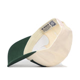 The Colorado State Rams Stride Hat by No Rivals is pictured upside down, revealing its interior with a mesh sweatband and a label displaying the NO RIVALS name alongside a QR code. This snapback cap features embroidered logos, making it the perfect addition to your next gameday fit.