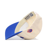 The Right Side Up Broncos Hat - Boise State - Classic by No Rivals is featured in cream and blue, displayed upside down to reveal an embroidered stylized bronco logo on the side and a QR code on the inner tag. This officially licensed snapback is both stylish and functional.