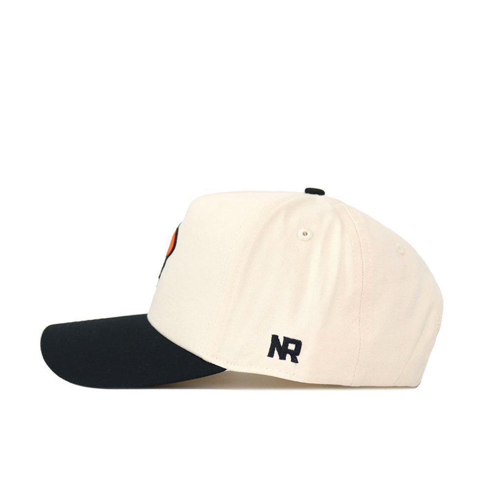 The No Rivals OSU Pistol Pete Patch Hat - Classic Black is a cream snapback with a black brim, made from premium cotton. Seen from the side, it showcases "NR" embroidered in black near the back for added style.
