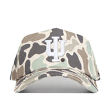 The Indiana Hoosiers Huntsman Hat by No Rivals is a camouflage baseball cap with a white IU logo on the center front, crafted from high-quality cotton, featuring a structured fit and an adjustable snap back closure.