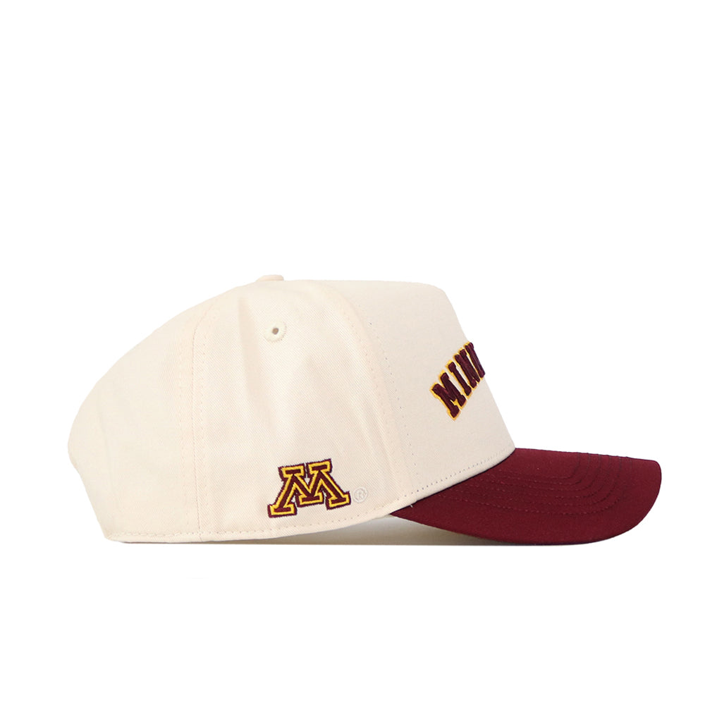 The No Rivals Right Side Up Minnesota Hat – Classic features a cream crown with a maroon brim. An embroidered yellow and maroon "M" logo accents the side, while "MINN" appears in bold maroon letters on the front. This officially licensed snapback offers authentic style and a comfortable fit.