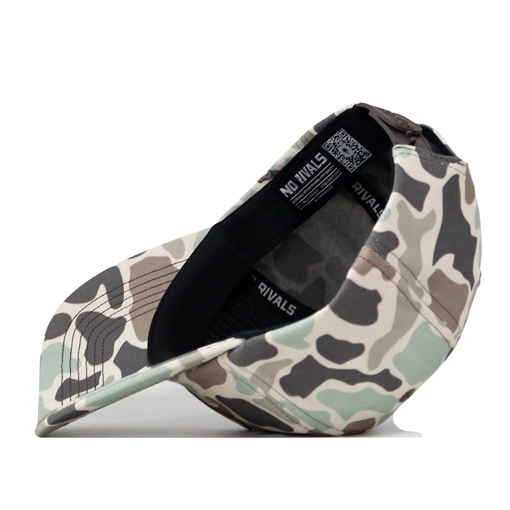 The Florida Gators Huntsman Hat by No Rivals is shown inside out, revealing its black inner band printed with NO RIVALS and a tag featuring a QR code. Crafted from high-quality cotton in a camouflage pattern, this structured snapback hat delivers both durability and modern style.