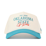 The No Rivals OSU N7 Vintage Hat (B2B) is a white and teal cotton baseball cap with "EST 1890 OKLAHOMA STATE Go Pokes" in teal and red on the front, plus a snapback closure for an adjustable fit.