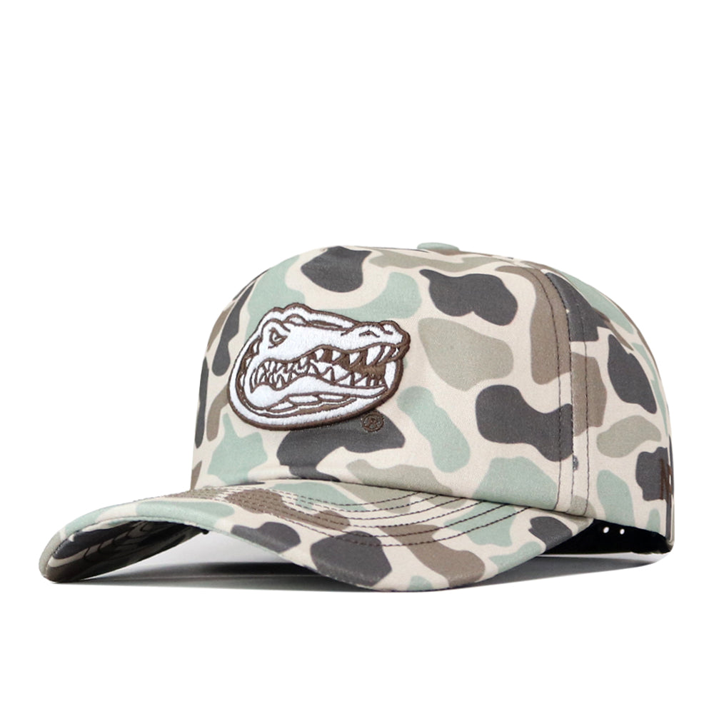 The No Rivals Florida Gators Huntsman Hat is a high-quality cotton camouflage baseball cap featuring a structured fit and a stylized embroidered alligator head logo on the front panel. Displayed at a slight angle against a white background, this snapback hat effortlessly combines durability with style.