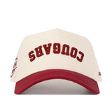 Show your campus pride with the No Rivals College of Charleston | Upside Down Cougars Hat - Classic, a stylish cream and red snapback featuring “COUGARS” embroidered upside down in bold red letters on the front.