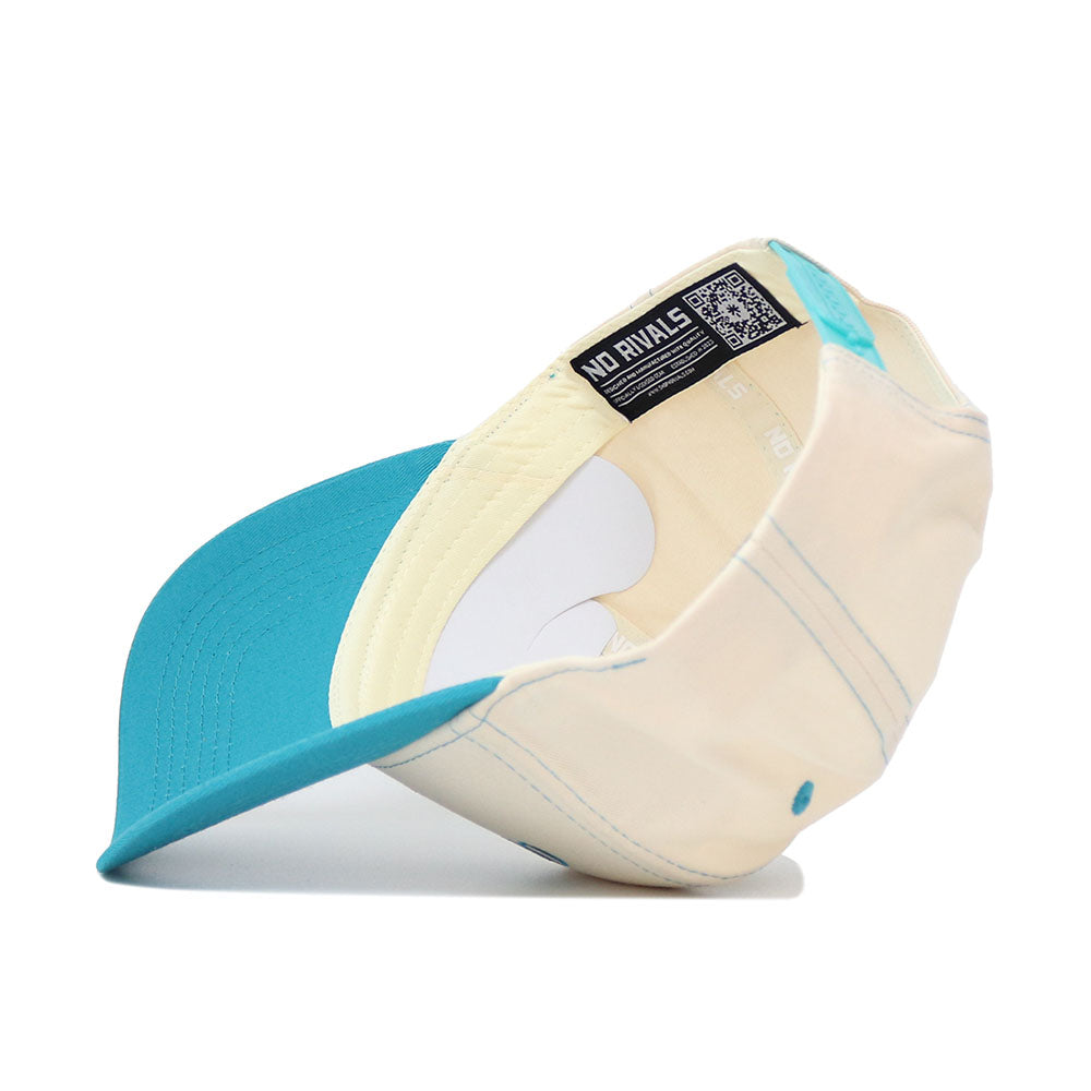 The OSU N7 Vintage Hat (B2B) by No Rivals is shown upside down, displaying its cream color, turquoise brim and accents, high-quality cotton lining, detailed stitching, and signature NO RIVALS tag.