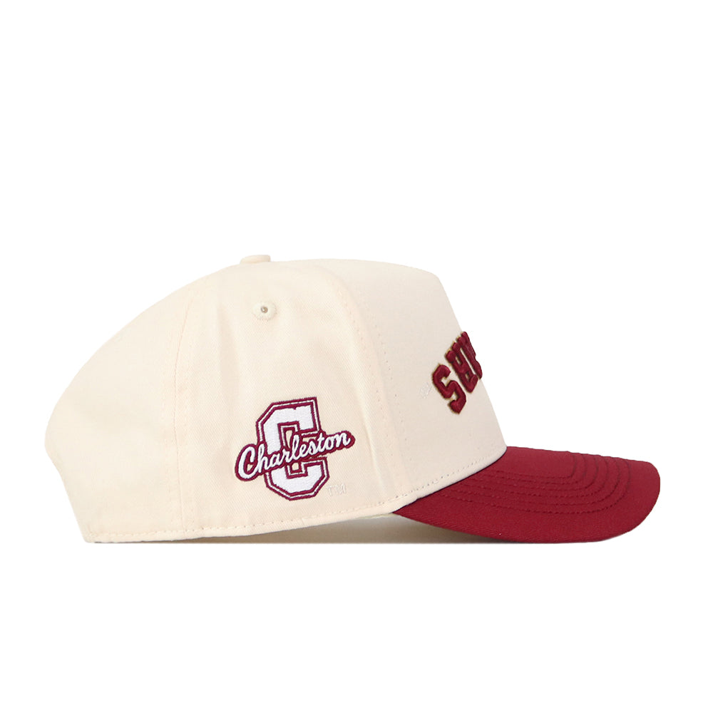 The No Rivals College of Charleston | Upside Down Cougars Hat - Classic features a cream color with a maroon brim, a snapback closure, “Charleston” embroidered on the front, and a large C logo on the side.