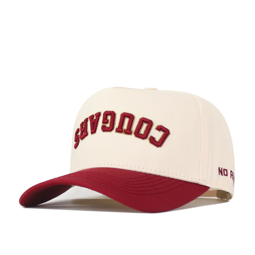 Show your school spirit with a twist in the College of Charleston | Upside Down Cougars Hat - Classic by No Rivals—a stylish cream and maroon snapback with “COUGARS” embroidered upside down on the front and “NO FUN” stitched on the side of the brim.