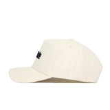 A side view of the cream App State Sideline Hat by No Rivals, featuring a black embroidered logo front, "NR" stitched on the side, curved brim, structured fit, ventilation eyelets, and made from high-quality cotton.