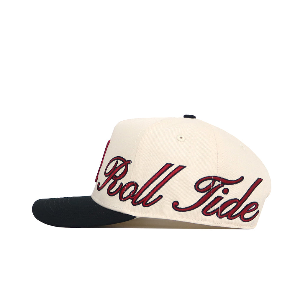 The Alabama Halftime Hat by No Rivals is a cream baseball cap with a black brim, made from high-quality cotton and featuring red "Roll Tide" embroidery on the side.