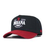The No Rivals Indiana Tailgate Hat is a black snapback with a red brim, featuring Indiana Hoosiers and the IU logo embroidered in white and red on the front. Made from high-quality cotton for a comfortable, structured fit.