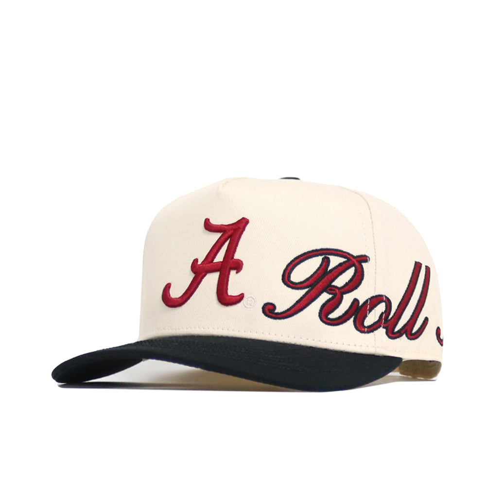 The Alabama Halftime Hat by No Rivals is a cream snapback with a dark brim and red cursive "A Roll" embroidery, made from high quality cotton for a structured fit.