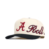 The Alabama Halftime Hat by No Rivals is a cream snapback with a dark brim and red cursive "A Roll" embroidery, made from high quality cotton for a structured fit.