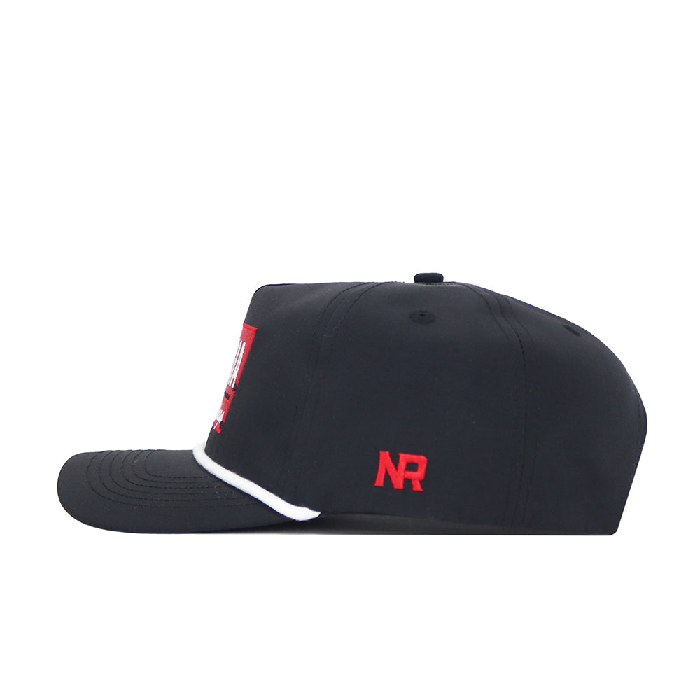 The Georgia Varsity Hat by No Rivals is a black nylon baseball cap with red NR initials on the side, white trim on the brim's edge, and an adjustable snap back, shown in a side profile view.