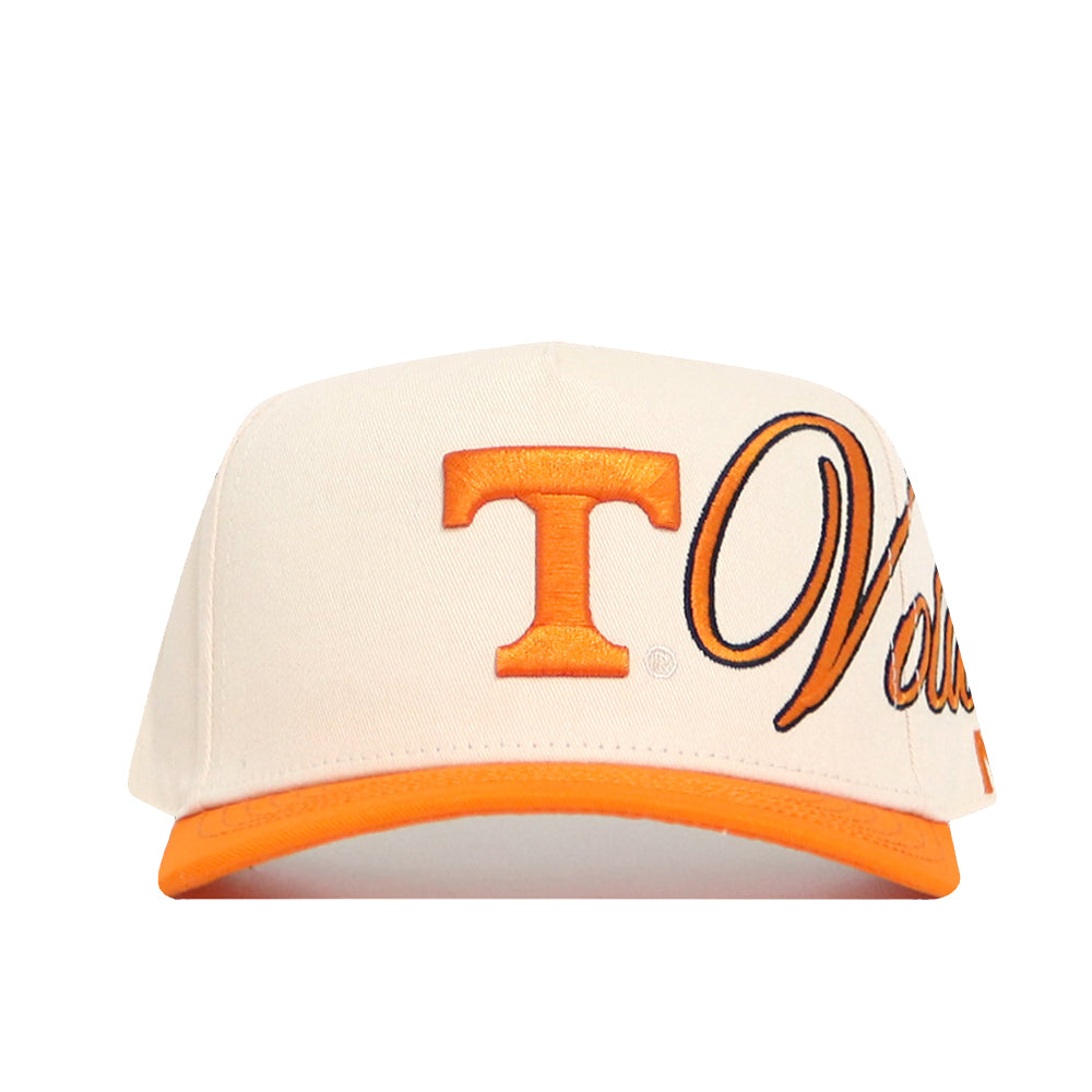 The No Rivals Tennessee Halftime Hat is a cream structured cap featuring an orange letter T, partial cursive text in orange and black, an orange bill and trim, and a classic snapback closure.